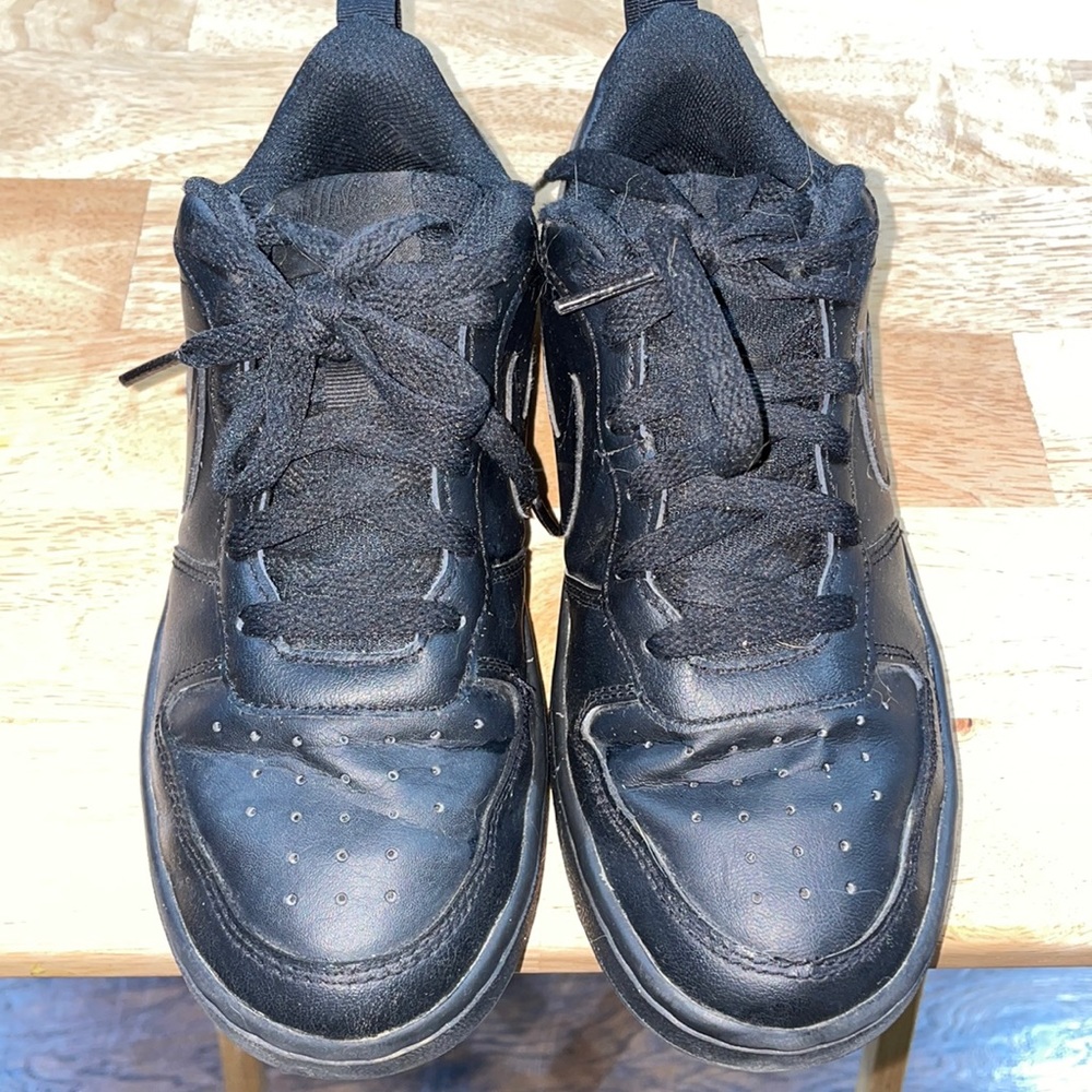Boys black air force one sneakers slightly worn lots of life left in them.Size 4